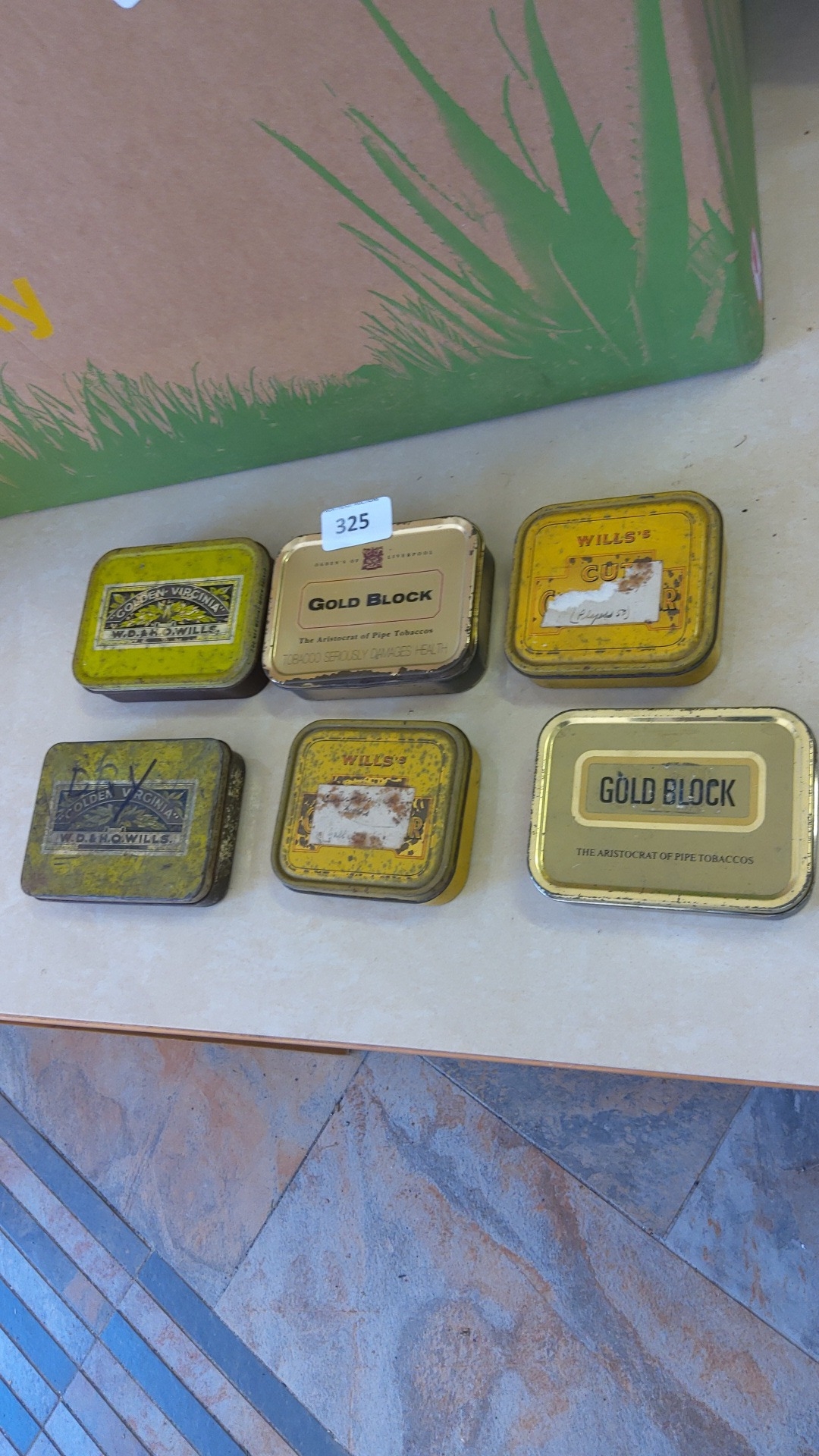 A group of W.D. & H.O. Wills metal tobacco tins, including Golden ...