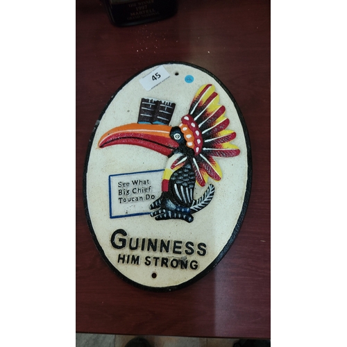 Guinness cast-iron advertising plaque of oval form, painted in relief ...