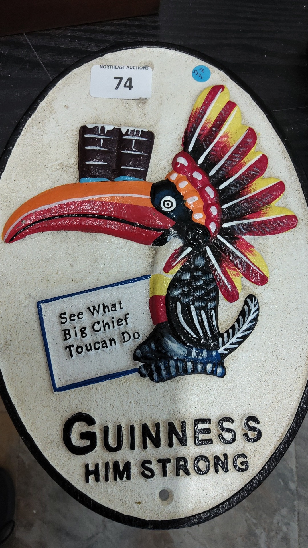 Guinness painted cast-iron advertising plaque of oval form, depicting a ...