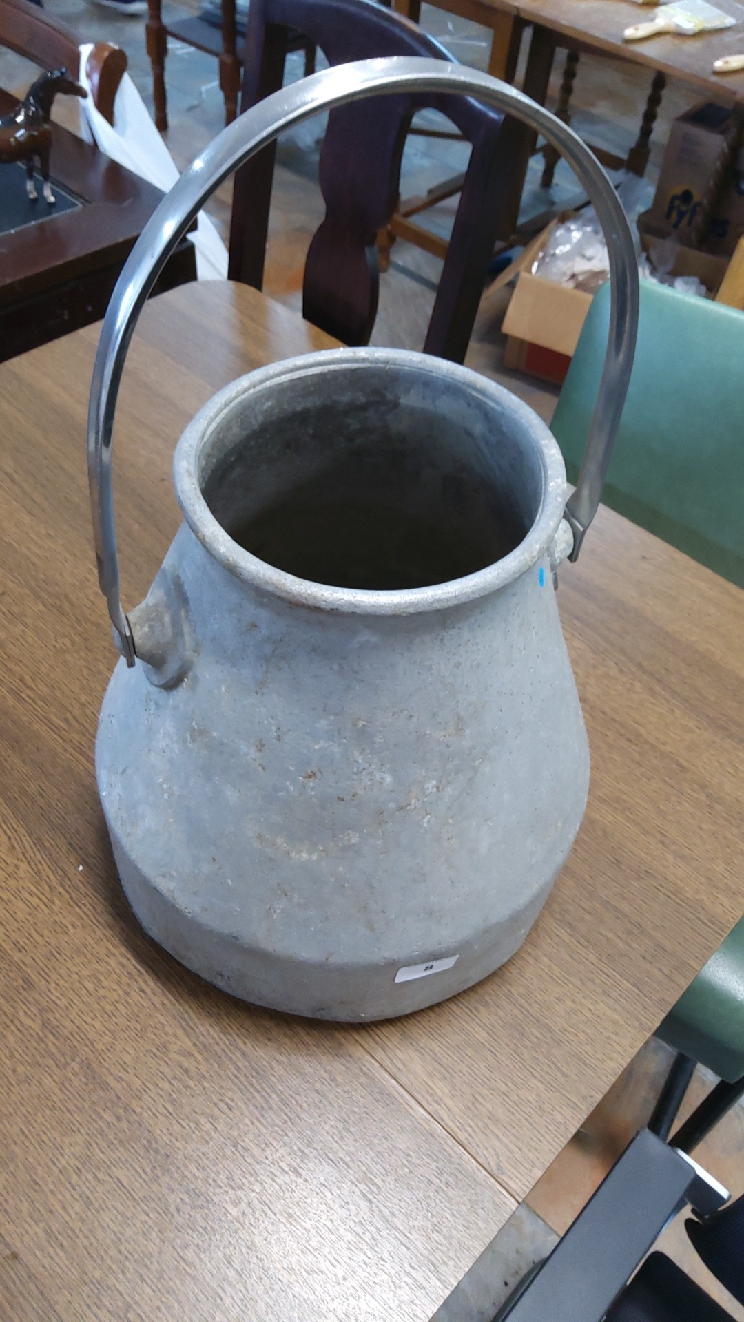 Aluminium milk pail of tapering form, with a broad rolled rim, side ...
