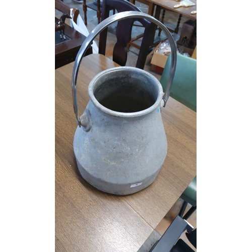 Aluminium milk pail of tapering form, with a broad rolled rim, side ...