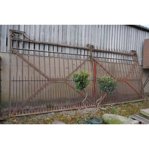 176 - Pair of wrought iron entrance gates with points, scrolls and bottom roller. 20ft opening