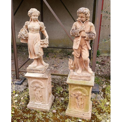 189 - A pair of terracotta statues on plinths 53