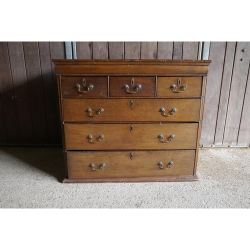 334 - An oak chest of 3 small and 3 long drawers