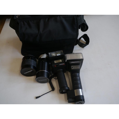 43 - Selection of Miranda and Tamron lenses and Harimex TZ36 and Metz 45 CT-4 flash guns in bag.