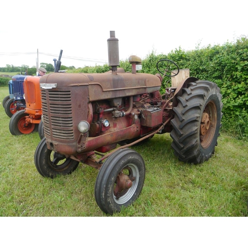 128 - McCormick Deering W6 tractor. Original, rear wheel weights, pulley, good tyres. Runs. SN. WBK 21787.... 