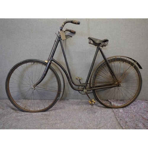 412 - Ladies Singer bicycle with original pump. Unrestored. Circa 1900's