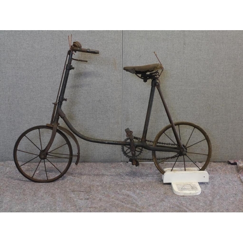 417 - The Stonehouse Nipper child's bike on wooden stand. Circa 1920.