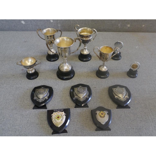 472 - 12 Grasstrack trophies and shields from the 50-60's presented to J.Gould and G.Gould later donated t... 