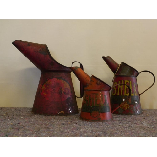 802 - 2 Shell motor oil jugs and 1 Esso oil jug