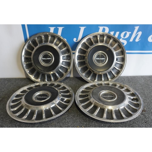 23 - 4 Triumph hubcaps