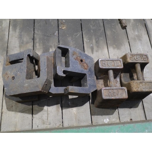 129 - 4 Compact tractor weights, 2x 56lbs weights