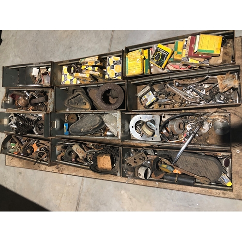 310 - Racking full of motorcycle and car spares. Including a large quantity of BSA and Triumph parts. Appr... 