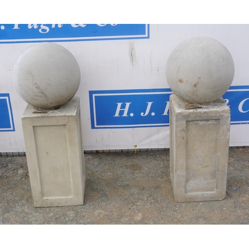 37 - Pair of pillar top balls on plinths 38x16