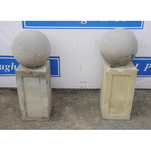 39 - Pair of pillar top balls on plinths 38x16