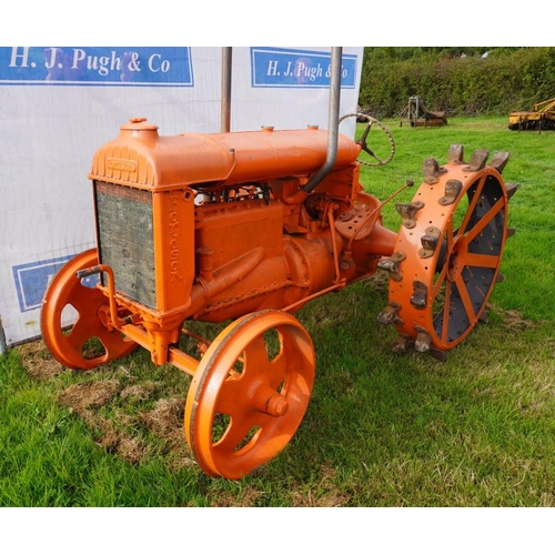 64 - Fordson Standard N tractor. Orange, steel wheels, pulley