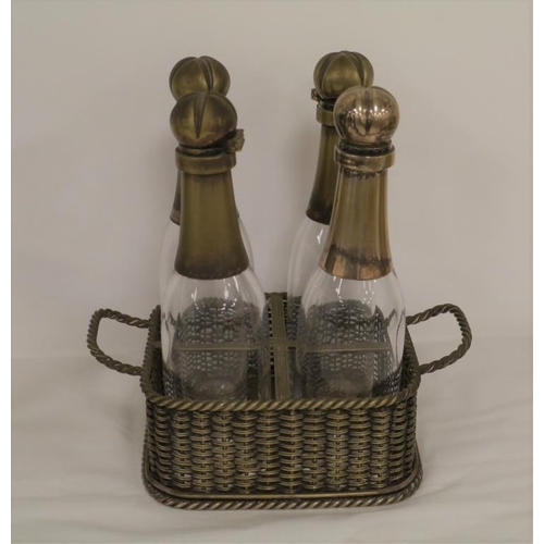 277 - 4 Glass bottles with silver plate neck and tops in metal basket