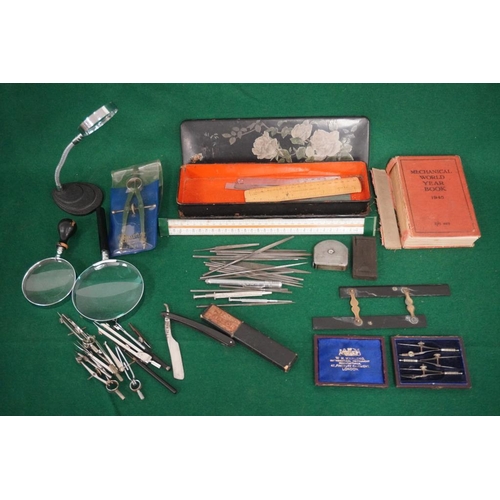 421 - 3 Magnifying glasses, paper mache box of assorted rulers, tray of assorted instruments including ebo... 