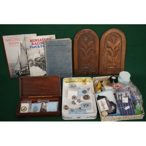 423 - 2 Carved oak plaques, 3 railway/ship books, 2 tins of assorted lapel badges and tray of sewing acces... 