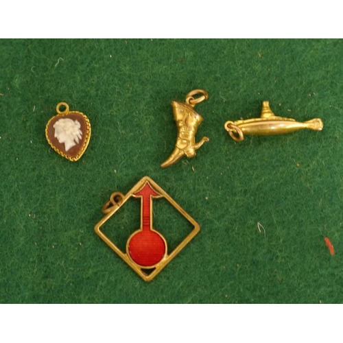 54 - 4 Yellow metal charms, some possibly gold