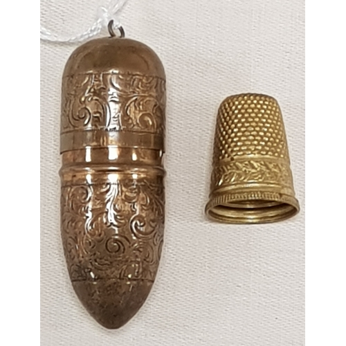 66 - Yellow metal thimble possibly gold in holder