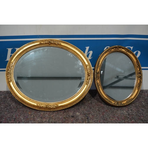 476 - 2 Oval gilt framed mirrors