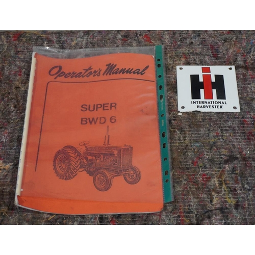 257 - International Super BWD6 operators manual and International enamel sign 4x4