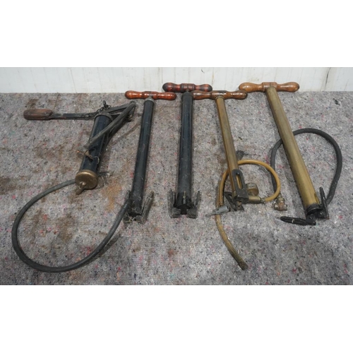 571 - 4 Old stirrup pumps and one other +VAT