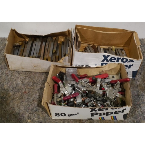 744 - 2 Boxes of assorted lathe cutters and box of clamps