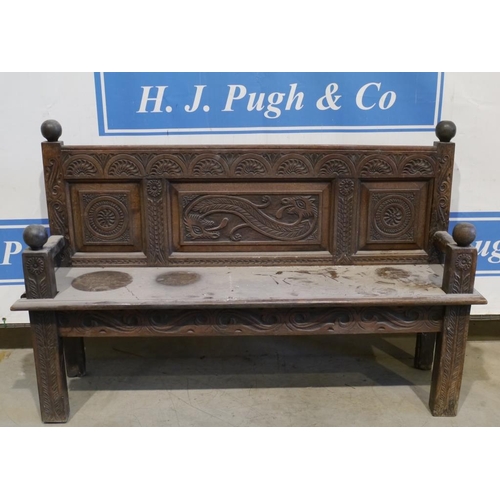140 - Oak heavily carved oriental style bench 59