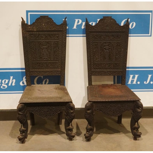 82 - Heavily carved oriental dining chairs