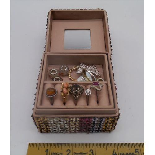 299 - Decorative ring box with some rings including silver