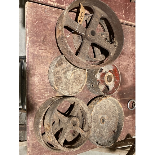 10 - 7 Various cast iron wheels and fly wheels