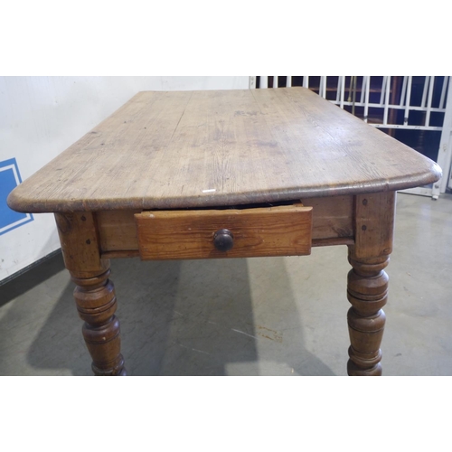 182 - Pine farmhouse kitchen table with drawer on casters 60x36x30