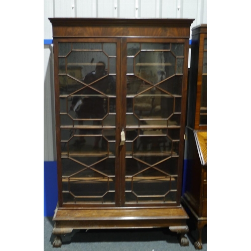 249 - Mahogany 2 door glazed bookcase on stand 44x75