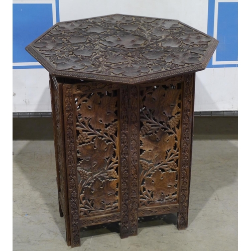 25 - Octagonal carved table with grape vine pattern 23x21