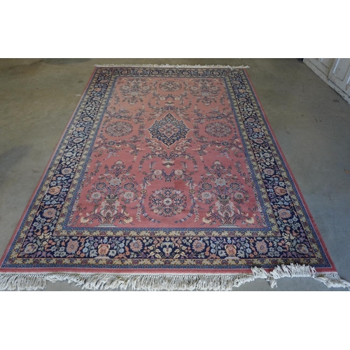 268 - Floral patterned red and blue wool rug 120x79