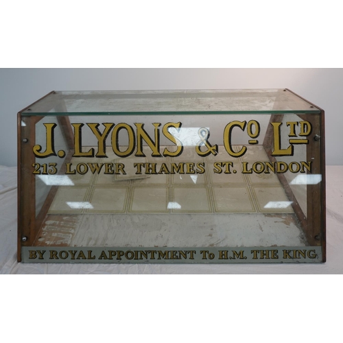 676 - Old glass display cabinet featuring J.Lyons & Co Ltd logo 38x27 1/2