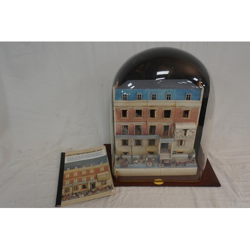 747 - Model of an 1880's house in glass display case A/F with original catalogue