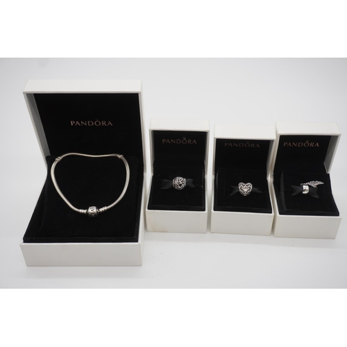 823 - Pandora bracelet in box and 3 boxed Pandora charms