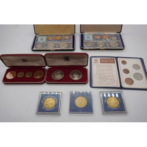 827 - Various boxed presemtation coins including Queen Elizabeth 90th birthday coins, Britains first decim... 