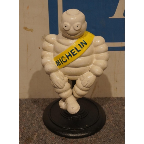 867 - Cast iron Michelin man on plinth