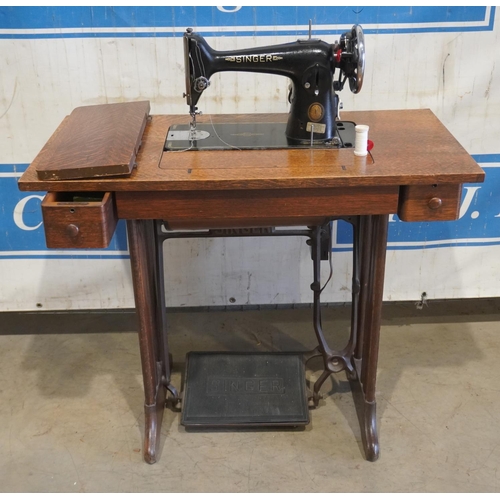 422 - Singer sewing machine No. EF 548239 on oak treddle base