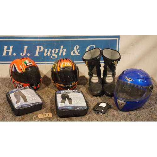 223 - Box of riding gear to incude pair of second hand boots, new Oxford Rainsea over trousers, 3 helmets