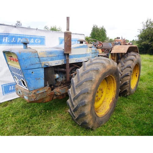 128 - County Supersix tractor. Hydraulic assister rams and cab. Runs & drives. SN.9K2 E10170