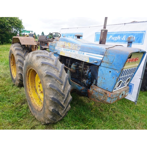 128 - County Supersix tractor. Hydraulic assister rams and cab. Runs & drives. SN.9K2 E10170