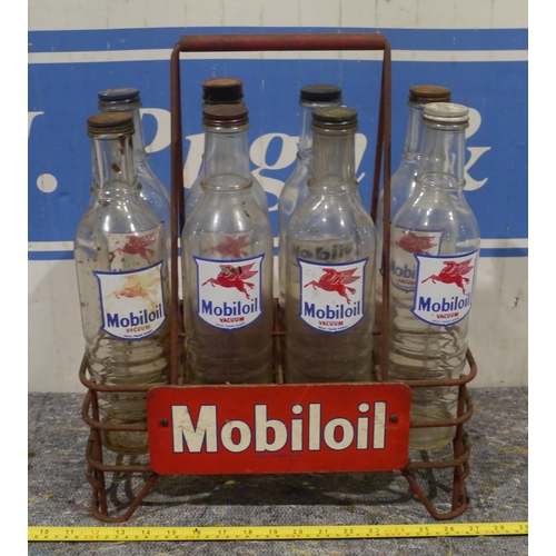 232 - 8 Mobiloil bottles in Mobiloil bottle rack