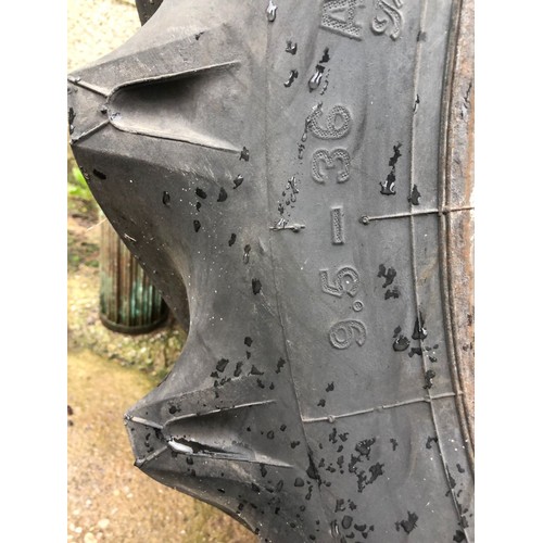 143 - Pair of rear tractor tyres. As new. 9.5-36