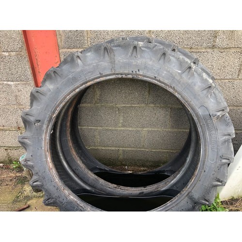 143 - Pair of rear tractor tyres. As new. 9.5-36