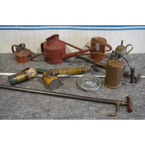20 - Old watering cans, sprayers, and powder blowers